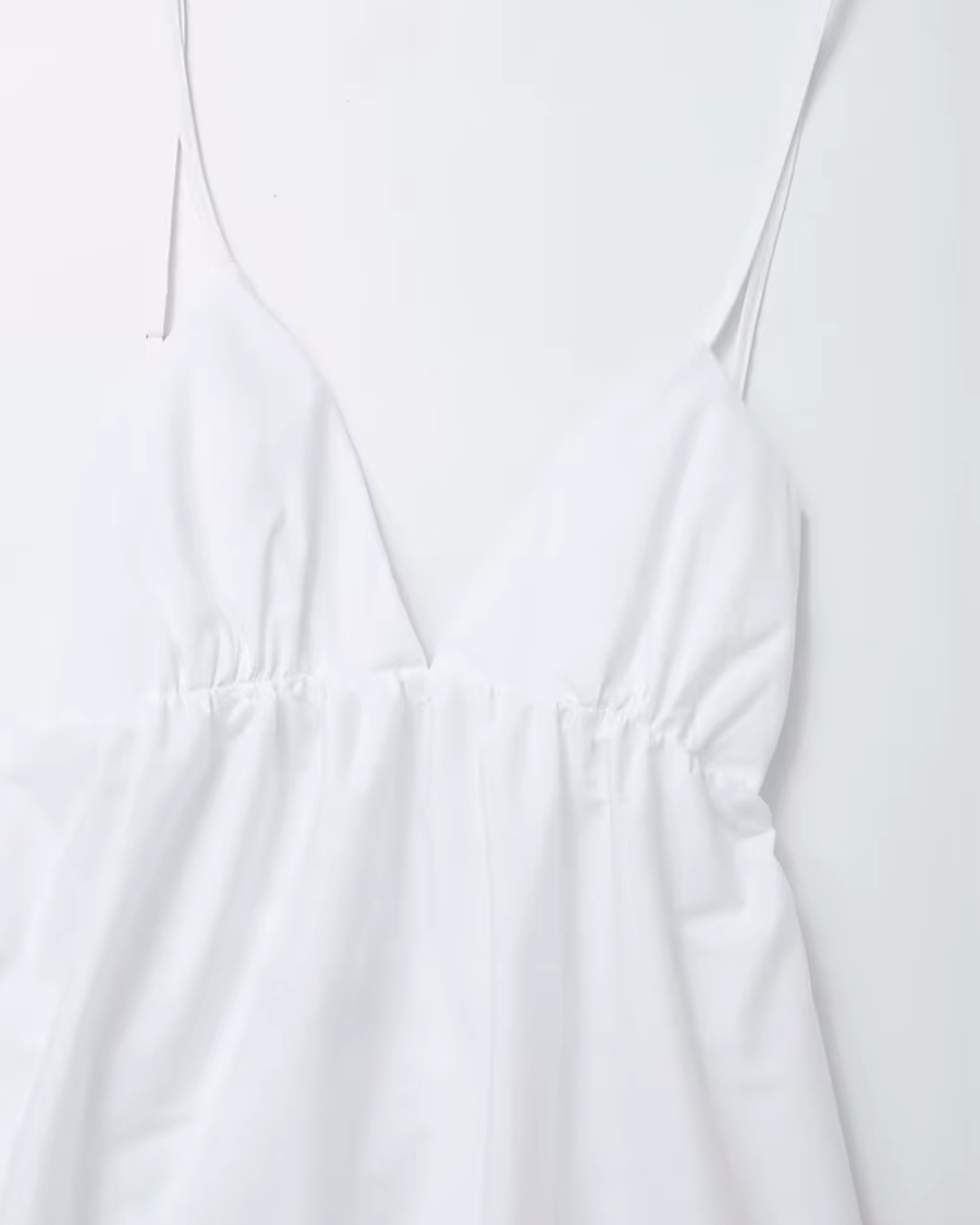 Witte Elegante Halterjurk met V Hals en Spaghettibandjes